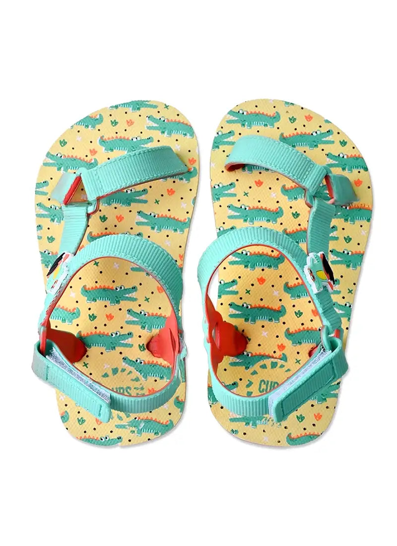 Youth boys’ sandal with a surfing croc print.