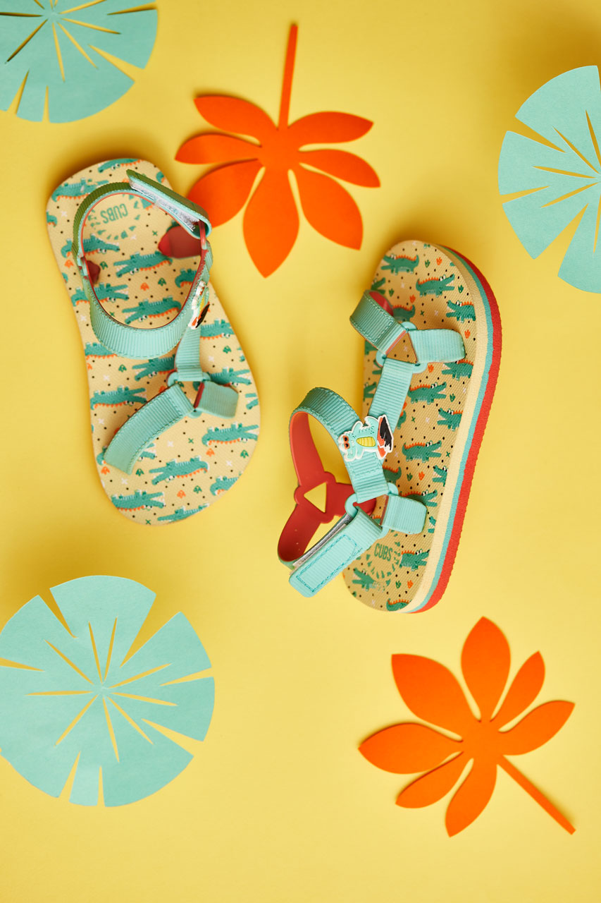 Youth boys’ sandal with a surfing croc print.